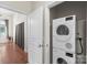 Laundry room area with stacked Bosch washer and dryer units at 1315 East Blvd # 203, Charlotte, NC 28203