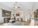 Cozy living room showcasing hardwood floors and an open layout leading to the kitchen area at 1315 East Blvd # 203, Charlotte, NC 28203