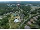 An aerial view of the neighborhood including a pool, playground, and tennis courts at 14010 Promenade Dr, Huntersville, NC 28078