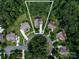 Aerial view of the home, showcasing its placement within a lush, tree-lined cul-de-sac neighborhood at 14010 Promenade Dr, Huntersville, NC 28078