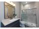 Modern bathroom with vanity, large mirror, and a stunning marble walk-in shower at 14010 Promenade Dr, Huntersville, NC 28078