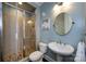 Bathroom features a glass enclosed shower with tile surround and pedestal sink at 14010 Promenade Dr, Huntersville, NC 28078