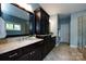 Bathroom features a large vanity with double sinks, cabinets, and walk-in shower at 14010 Promenade Dr, Huntersville, NC 28078