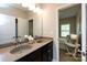 Bathroom featuring dual sinks, granite countertops, and plenty of cabinet space at 14010 Promenade Dr, Huntersville, NC 28078