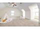 Cozy bedroom area with vaulted ceiling, and window that provide plenty of natural light at 14010 Promenade Dr, Huntersville, NC 28078