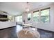 Cozy breakfast nook with a round table, pendant lighting, and large windows offering natural light at 14010 Promenade Dr, Huntersville, NC 28078