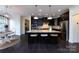 Well-equipped kitchen with dark cabinets, granite countertops, a large island, and stainless steel appliances at 14010 Promenade Dr, Huntersville, NC 28078