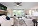Spacious living room boasting a stone fireplace, large windows, and modern, neutral decor at 14010 Promenade Dr, Huntersville, NC 28078