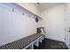 Functional mudroom with a built-in bench, storage, and coat hooks for organization at 14010 Promenade Dr, Huntersville, NC 28078