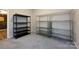 A view of storage room with carpeted floors featuring both dark metal and chrome metal shelves at 14010 Promenade Dr, Huntersville, NC 28078