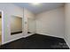 Spacious workout room featuring a rubber floor, large mirrors, and neutral paint at 14010 Promenade Dr, Huntersville, NC 28078