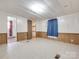 Bedroom featuring paneled walls, tile floors, and an open closet space at 1406 Old Puckett Pl # 14, York, SC 29745
