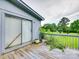 Side-view of the back of the house with sliding glass doors out to a wooden deck at 1406 Old Puckett Pl # 14, York, SC 29745