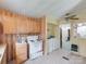 Kitchen featuring an oven, washer, dryer, wood cabinets, and a ceiling fan at 1406 Old Puckett Pl # 14, York, SC 29745