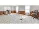 Bright living room showcases laminate flooring, chair, wood paneling and natural light from the windows at 1406 Old Puckett Pl # 14, York, SC 29745
