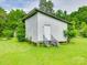View of wooden shed with a white door and short staircase at 1406 Old Puckett Pl # 14, York, SC 29745