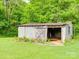 View of the shed with an open door and block-construction back at 1406 Old Puckett Pl # 14, York, SC 29745