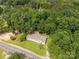 Aerial view of a home surrounded by green trees, showing the property's landscape at 159 Blackmon Pond Rd, Lancaster, SC 29720