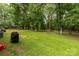 A beautiful outdoor space, enhanced by mature trees and a well maintained grassy area at 159 Blackmon Pond Rd, Lancaster, SC 29720