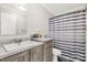 Full bathroom with a sink, toilet and shower with a striped curtain at 159 Blackmon Pond Rd, Lancaster, SC 29720