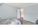 Light-filled bedroom with neutral tones, a view into another room, and carpeted flooring at 159 Blackmon Pond Rd, Lancaster, SC 29720