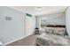 Comfortable bedroom with painted blue walls and decor for a beachy vibe at 159 Blackmon Pond Rd, Lancaster, SC 29720