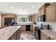 Spacious kitchen featuring stone countertops, center island, and stainless steel appliances at 159 Blackmon Pond Rd, Lancaster, SC 29720