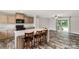 Kitchen with granite counters, wood cabinets and a large island with seating at 159 Blackmon Pond Rd, Lancaster, SC 29720