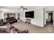 Open concept living room with a brown leather couch and neutral carpet at 159 Blackmon Pond Rd, Lancaster, SC 29720
