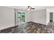 Bright living room with dark wood floors and sliding glass doors to private deck at 159 Blackmon Pond Rd, Lancaster, SC 29720