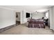 Spacious living room featuring a neutral colored carpet and large windows that provide natural light at 159 Blackmon Pond Rd, Lancaster, SC 29720