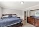 Cozy bedroom with a large bed set and a door leading to the bathroom at 159 Blackmon Pond Rd, Lancaster, SC 29720