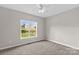 Bright bedroom with neutral walls, soft carpet, a ceiling fan and a bright window at 159 Forest Abbey Ln, China Grove, NC 28023