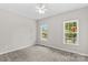 Carpeted bedroom with neutral walls and two windows offering natural light and outside views at 159 Forest Abbey Ln, China Grove, NC 28023
