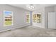 Bright bedroom with soft carpet and three bright windows at 159 Forest Abbey Ln, China Grove, NC 28023