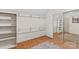 Well-lit closet with built-in shelving and a sliding mirrored door with storage space at 159 Forest Abbey Ln, China Grove, NC 28023