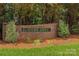 Elegant brick community sign for Forest Abbey, set amidst lush landscaping and mature trees at 159 Forest Abbey Ln, China Grove, NC 28023