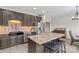 Kitchen featuring a black granite sink, stainless appliances, breakfast bar, and wood floors at 159 Forest Abbey Ln, China Grove, NC 28023