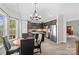Open kitchen featuring wood floors, stainless steel appliances, island, and breakfast table at 159 Forest Abbey Ln, China Grove, NC 28023