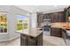Charming kitchen with wood floors, stainless appliances, granite countertop, and bright window at 159 Forest Abbey Ln, China Grove, NC 28023