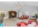 Spacious living room with entertainment center, plush carpet, and access to dining area at 159 Forest Abbey Ln, China Grove, NC 28023