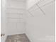 Walk-in closet features wire shelving and plush carpet at 159 Forest Abbey Ln, China Grove, NC 28023