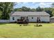 Large backyard with a deck, fire pit, and outdoor seating, great for entertaining at 1593 Bloomfield Rd, Rock Hill, SC 29732