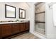Bathroom with a double sink vanity and glass-enclosed shower with decorative tile at 1593 Bloomfield Rd, Rock Hill, SC 29732