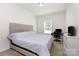 Cozy bedroom with a comfortable bed, desk, and natural light from the window at 1593 Bloomfield Rd, Rock Hill, SC 29732
