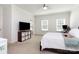Bright, carpeted bedroom with dual windows, TV, and ample storage, creating a comfortable and functional space at 1593 Bloomfield Rd, Rock Hill, SC 29732