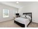 Bright bedroom features natural light from two windows and comfortable carpet flooring at 1593 Bloomfield Rd, Rock Hill, SC 29732