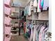 Walk-in closet featuring rows of hanging clothes and plenty of shelves for storage at 1593 Bloomfield Rd, Rock Hill, SC 29732