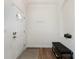 Neat entryway with a white front door, coat hooks, and storage bench at 1593 Bloomfield Rd, Rock Hill, SC 29732