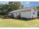 Side view of the home showcasing the deck and a well-maintained yard at 1593 Bloomfield Rd, Rock Hill, SC 29732